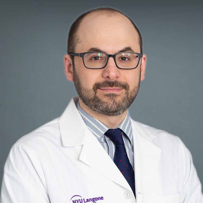 Dr. Justin S.