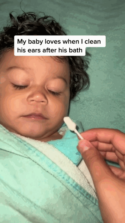 Cleaning a baby's ear after bath